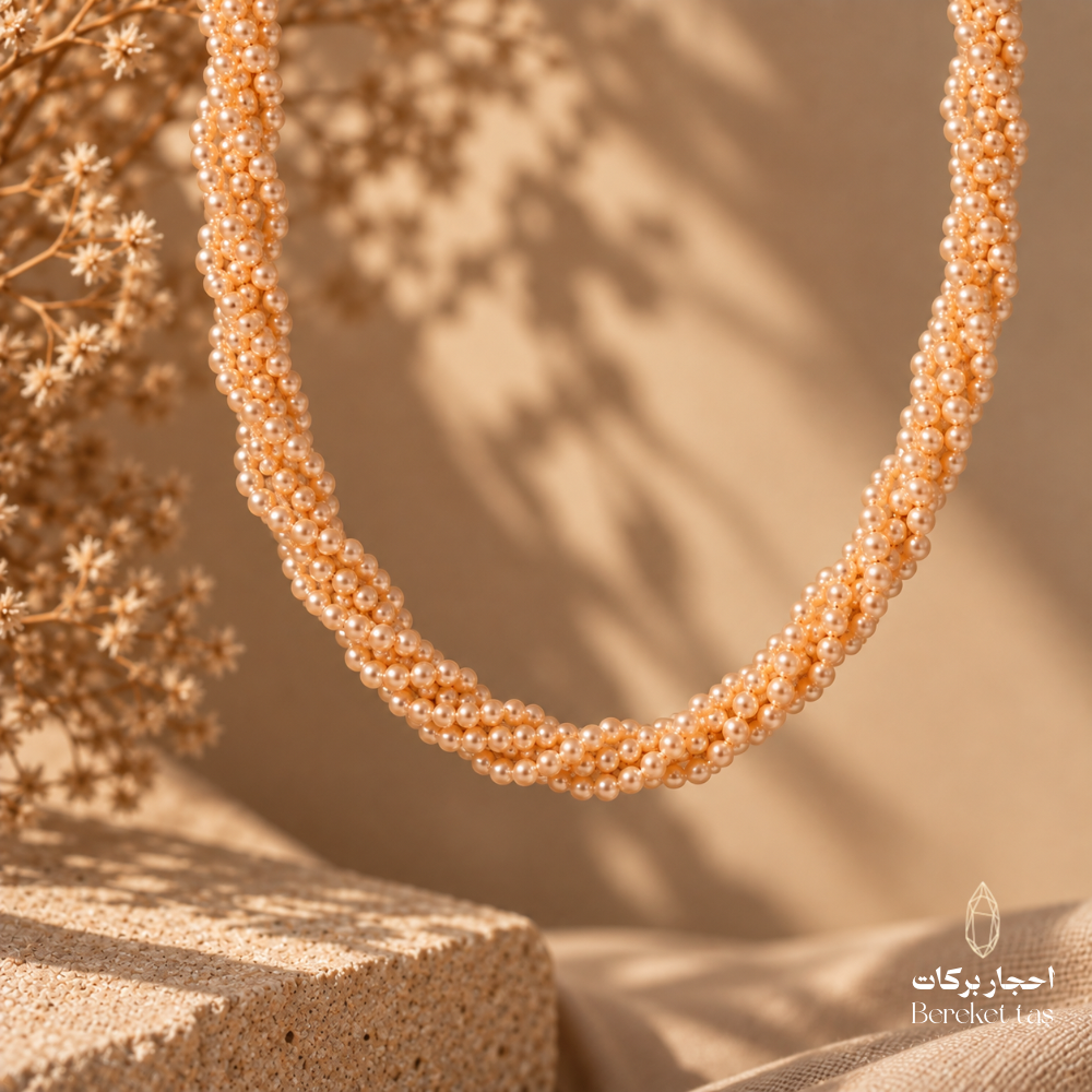 Close-up of a natural Pearl necklace featuring multiple rows of luminous pearl beads in a refined handmade design