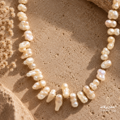 Close-up of a natural white Pearl necklace showing its unique shapes and luminous details