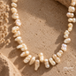 Close-up of a natural white Pearl necklace showing its unique shapes and luminous details