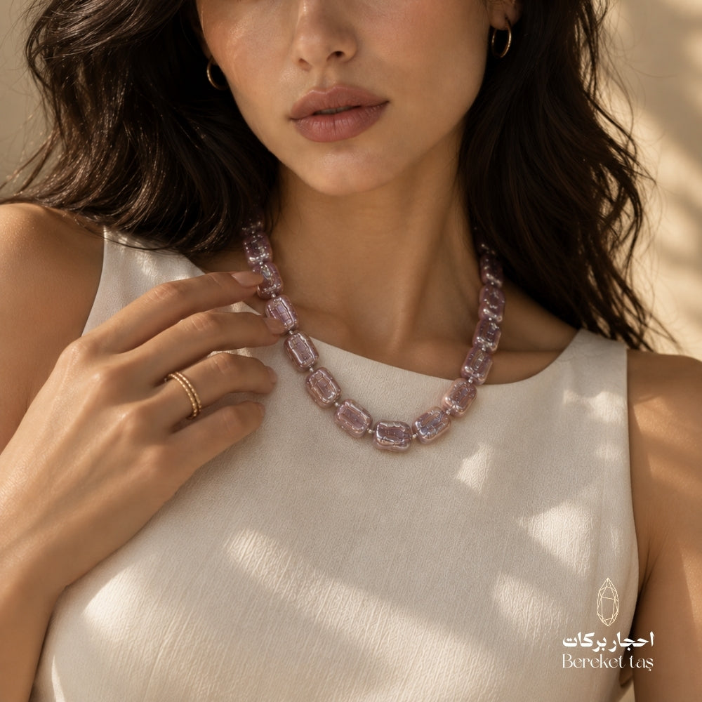 Handmade natural Pearl necklace in pink and light mauve tones styled with an elegant white outfit