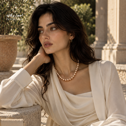 Natural Pearl handmade necklace styled with an elegant cream outfit in an outdoor setting