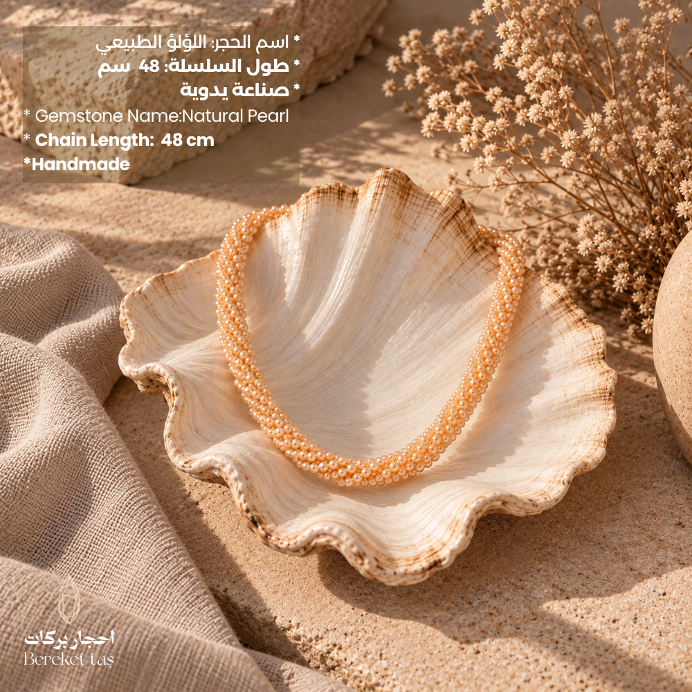 Natural Pearl handmade necklace displayed inside a seashell, featuring a 48 cm length and elegant pearl bead arrangement