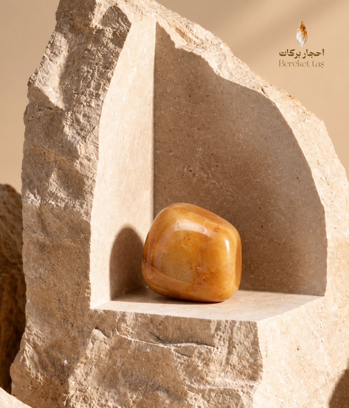 Natural polished Orange Aventurine stone displayed on a warm beige stone structure with soft natural lighting