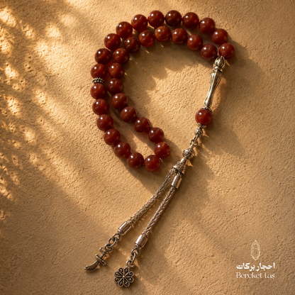 Natural red agate stone tasbih with polished 10 mm beads and silver-tone details by Bereket Tas