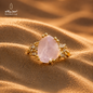 Natural rose quartz ring close-up with gold-plated copper setting