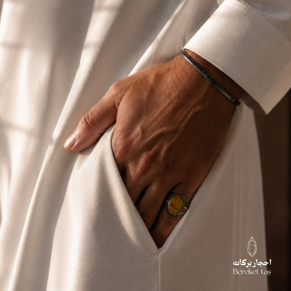 Natural Tiger Eye ring with honey brown stone and 925 silver, worn by a man