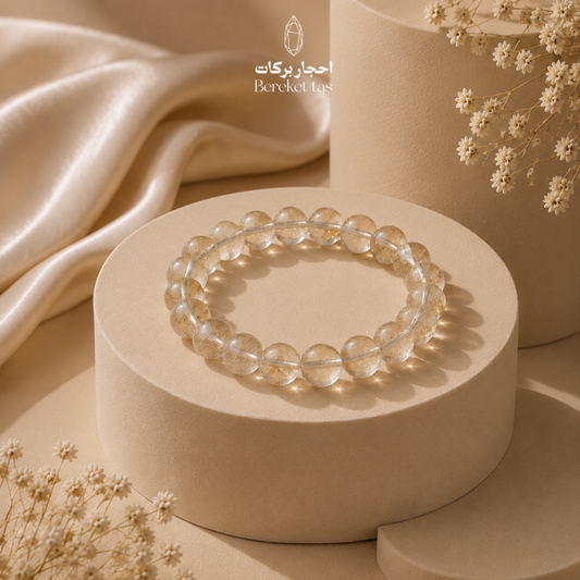 Natural transparent Peridot bracelet with 8 mm beads displayed on a beige pedestal