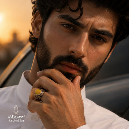 Natural yellow amber stone ring in 925 sterling silver worn by a man