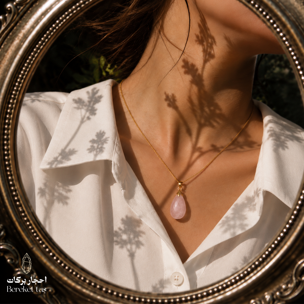 Natural pink Quartz pendant necklace with a gold-plated chain styled with an elegant white outfit