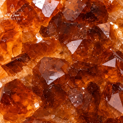 Close-up view of natural raw Citrine crystals showing detailed golden orange crystal formations and translucent surfaces