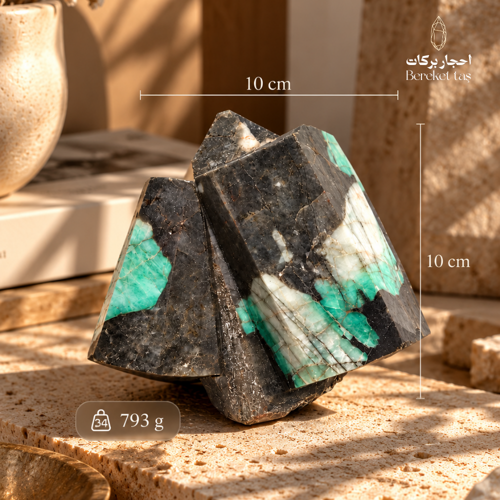 Natural raw Emerald stone showing its 10 cm length, 10 cm width, and 793 g weight, with green and white mineral patterns