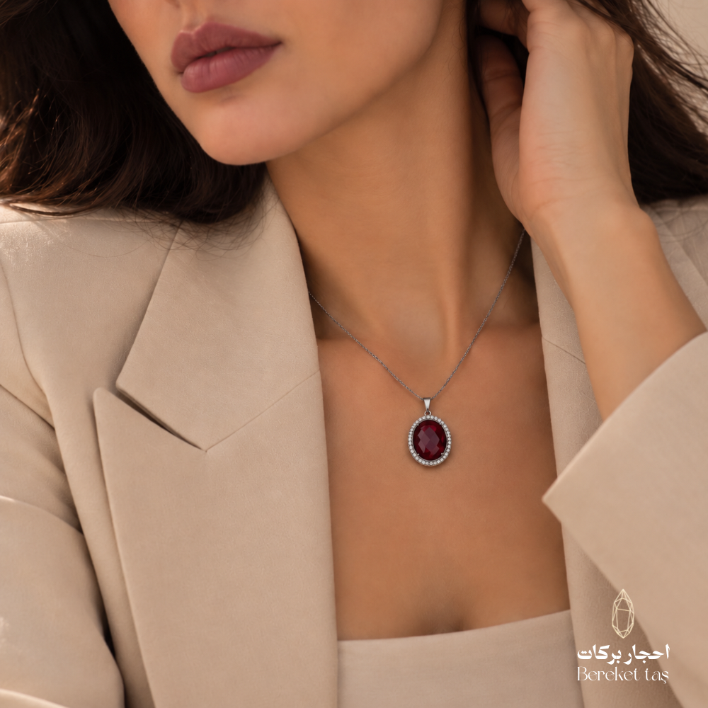 Close-up of a natural red Quartz pendant necklace with a silver chain