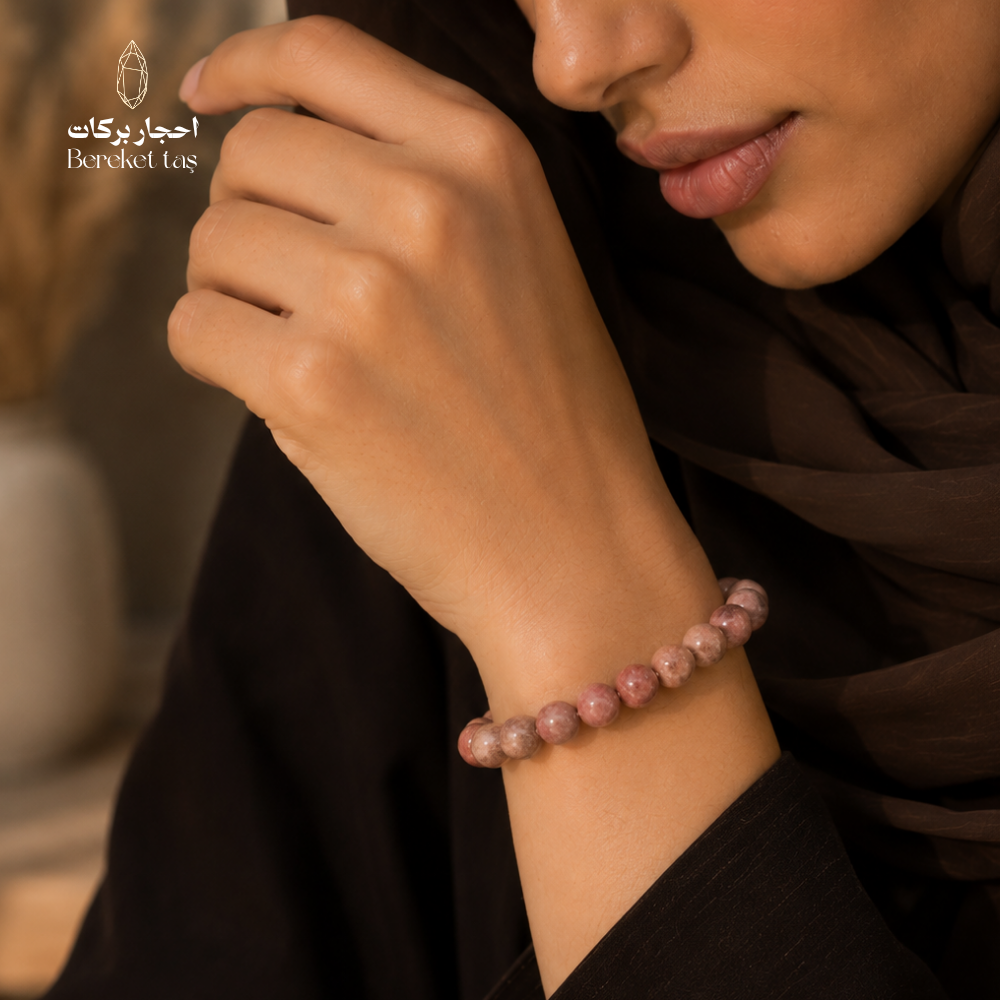Pink Rhodochrosite stone bracelet with 8 mm beads worn on the wrist