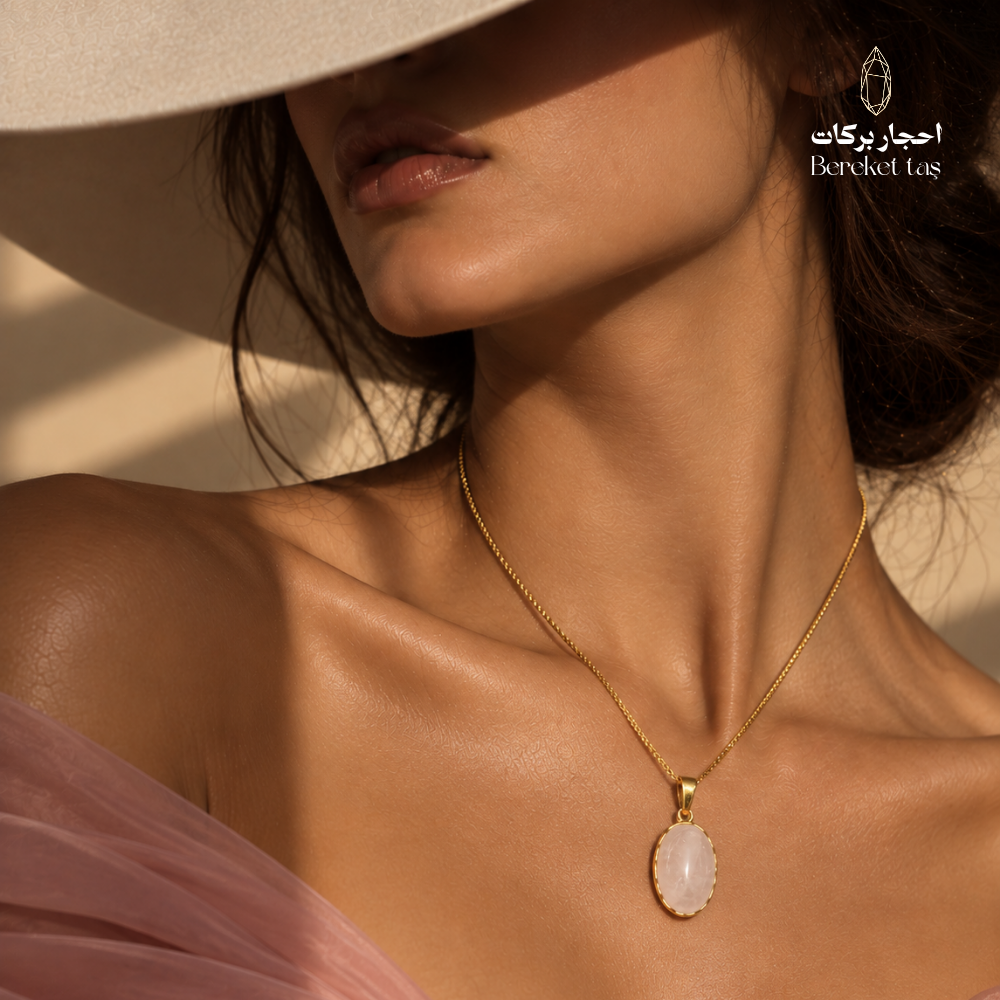 Natural Rose Quartz pendant necklace worn with a gold-plated chain and elegant pink outfit