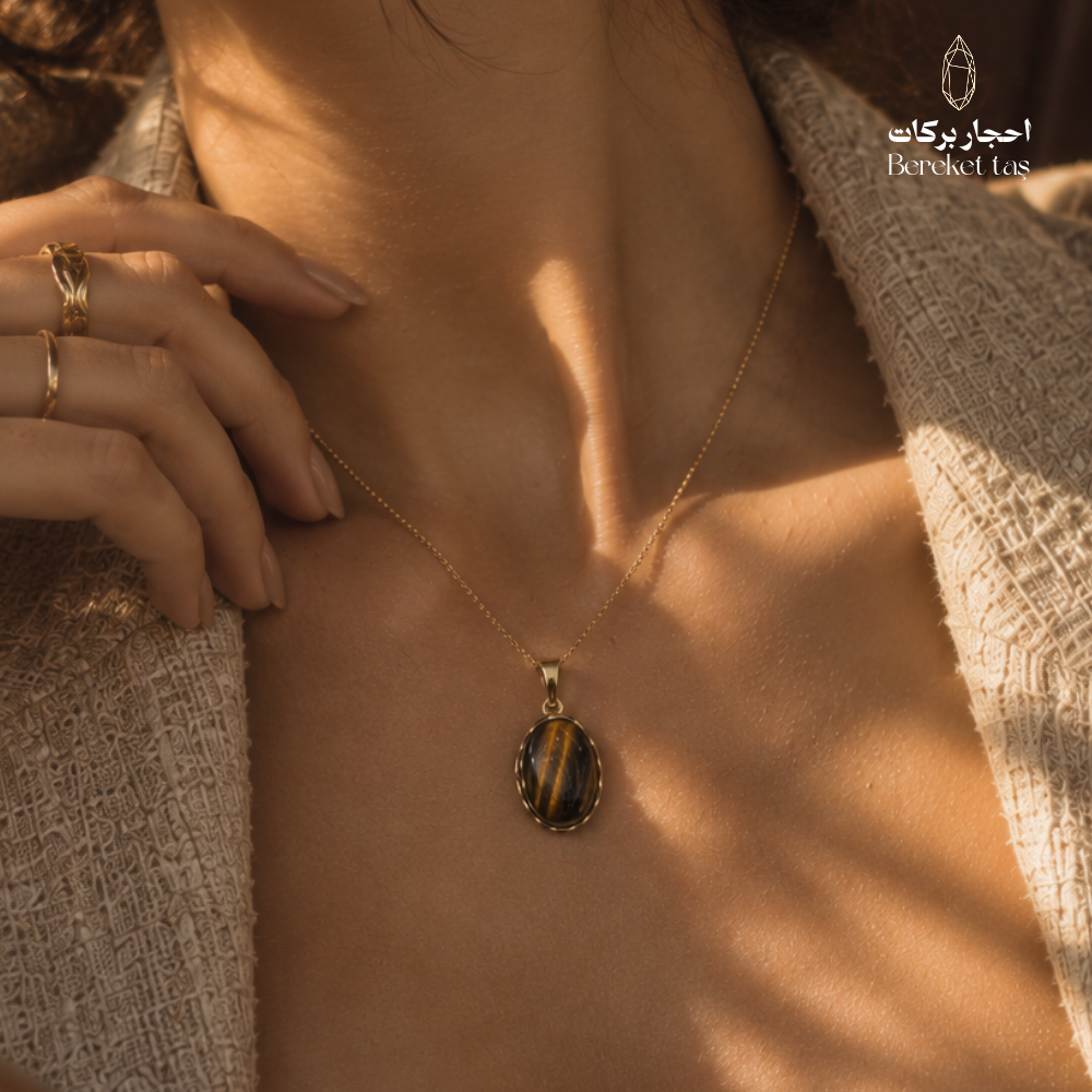 Natural Tiger Eye pendant necklace with a gold-plated chain shown in close-up
