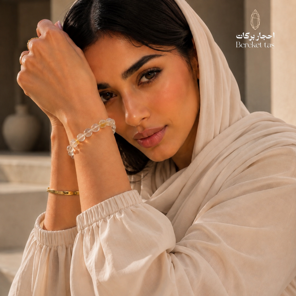 Woman wearing a transparent Topaz stone bracelet with 8 mm beads