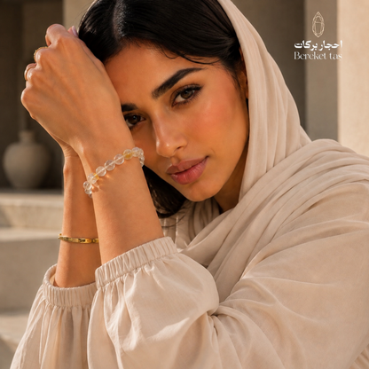 Woman wearing a transparent Topaz stone bracelet with 8 mm beads